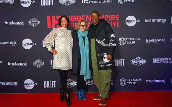 Roxanne Taylor, Michelle Satter and Deon Taylor on the red carpet.webp